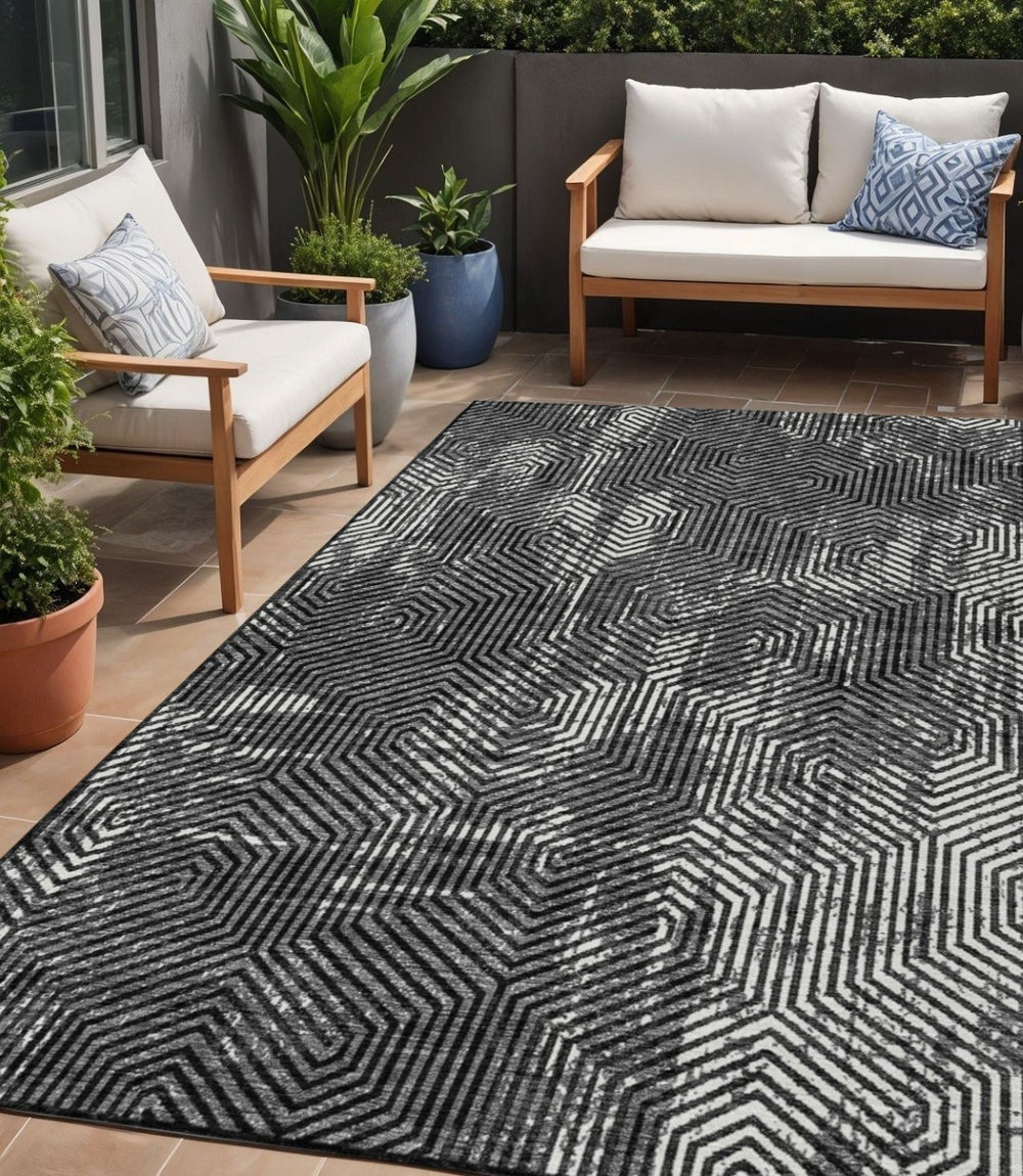 HomeRoots 5' Stylish Black and Ivory Geometric Indoor Outdoor Area Rug for Modern Living Spaces and Durability 5' X 8' 594522