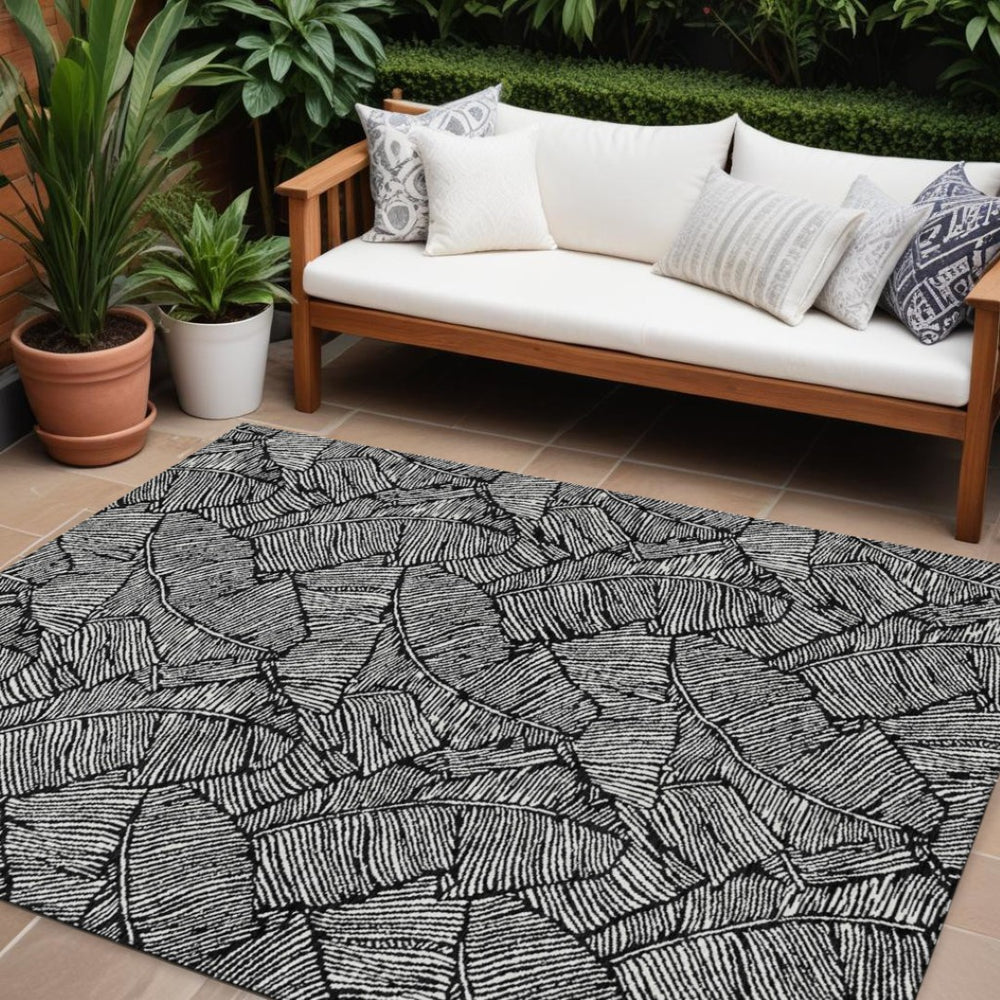HomeRoots 9' X 12' Black And Ivory Floral Rug – Stylish Washable Area Rug for Indoor & Outdoor Spaces 594609