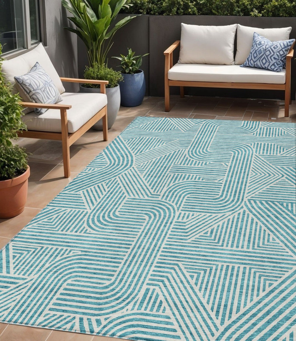 HomeRoots 5' Teal Blue and Ivory Abstract Area Rug - Stylish, Durable, and Washable for Indoor and Outdoor Use 5' X 8' 594960