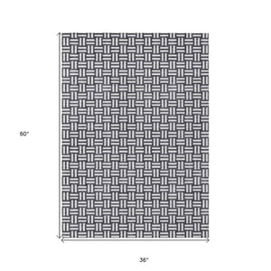 Homeroots 3' Black And Ivory Geometric Indoor Outdoor Area Rug - Stylish, Washable, Durable For Any Space 3' X 5' Polyester 595523