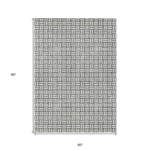 Homeroots 3' Black And Ivory Geometric Indoor Outdoor Area Rug - Stylish, Washable, Durable For Any Space 5' X 8' Polyester 595560