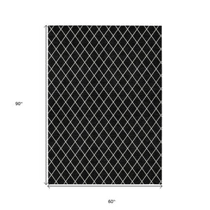 HomeRoots 5' Modern Black and Ivory Geometric Area Rug - Durable, Washable Design for Indoor and Outdoor Use 5' X 8' 596082