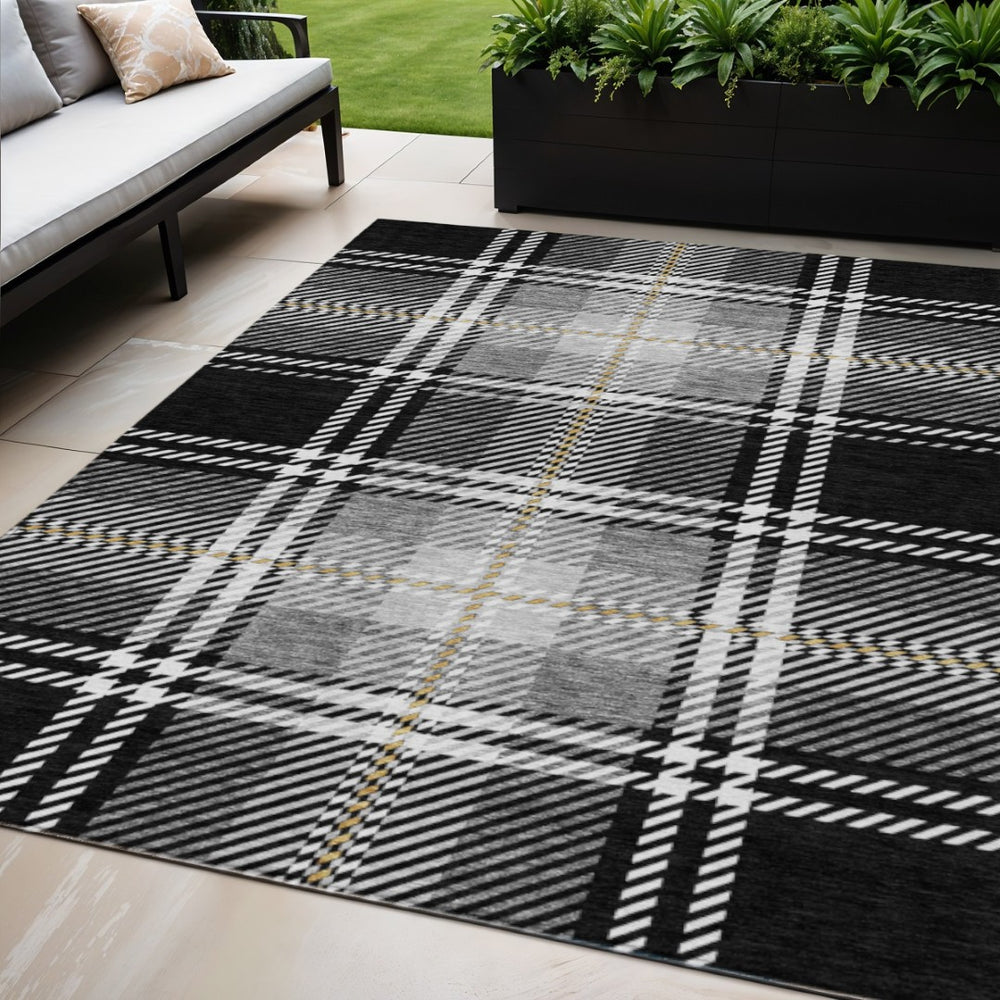 HomeRoots 5' Stylish Black Gold and Gray Plaid Indoor Outdoor Area Rug - Durable, Washable, and Versatile Design 5' X 8' 596310