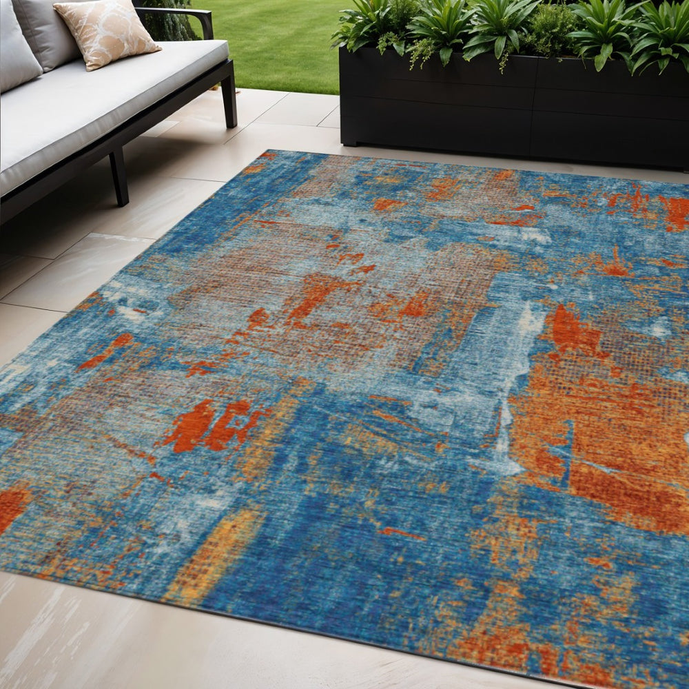 HomeRoots 5' Abstract Navy Blue and Orange Washable Area Rug - Stylish Indoor/Outdoor Décor for Any Space 5' X 8' 596879