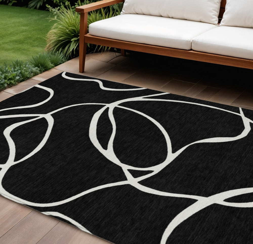 HomeRoots 9' X 12' Durable Black And Ivory Abstract Washable Area Rug for Indoor & Outdoor Spaces 597461