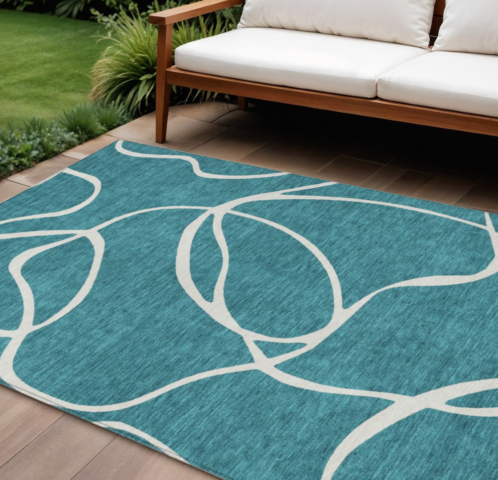HomeRoots 5' Teal Blue and Ivory Abstract Indoor Outdoor Area Rug – Stylish, Washable, and Stain Resistant! 10' X 14' 597528