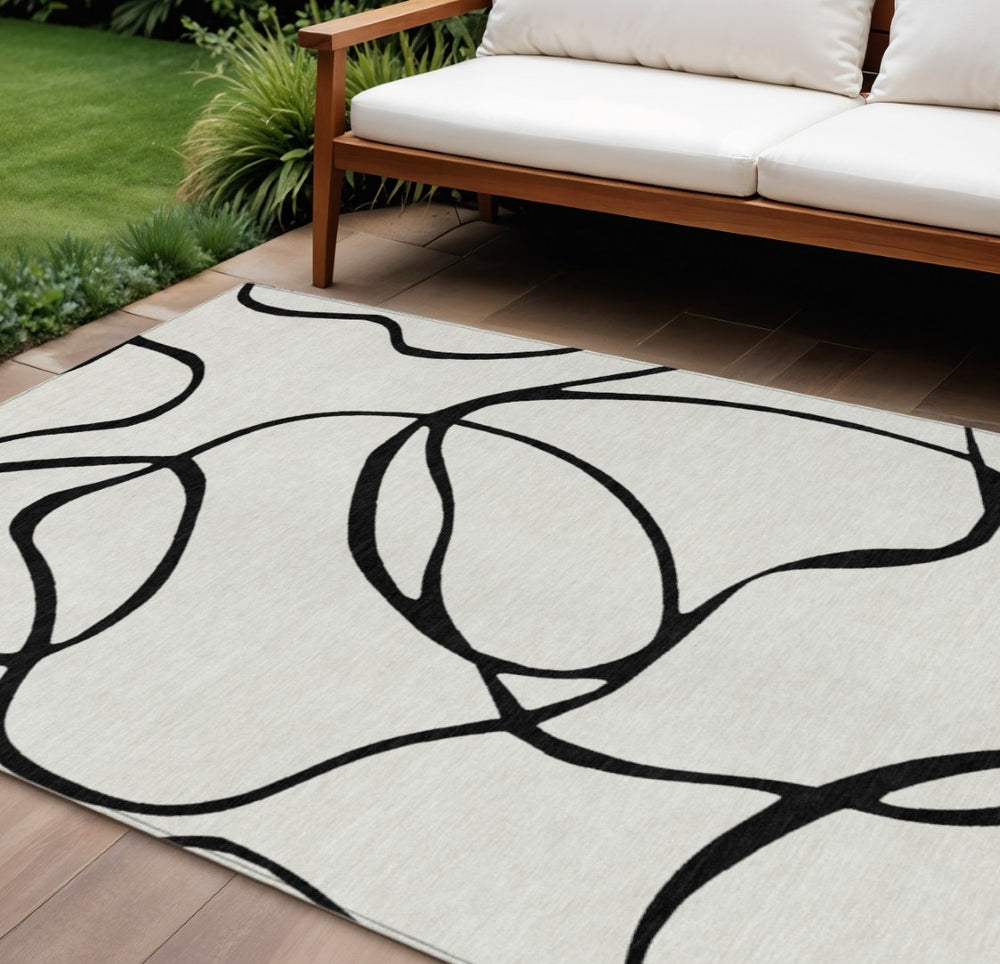 HomeRoots 9' X 12' Modern Black and White Abstract Washable Rug for Indoor Outdoor Spaces - Durable & Stylish 597533