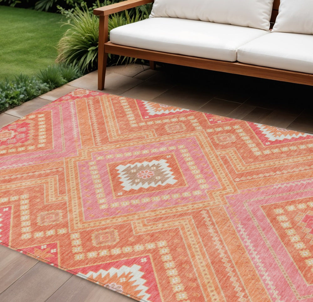 HomeRoots 5' Coral Pink and Ivory Tribal Area Rug - Stylish, Washable, Durable for Indoor and Outdoor Spaces 8' X 10' 598115