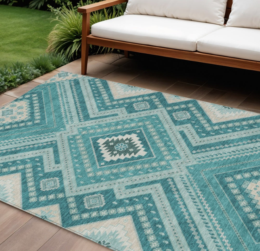 HomeRoots 5' Teal Blue and Ivory Tribal Area Rug - Durable, Washable Design for Indoor and Outdoor Spaces 10' X 14' 598159