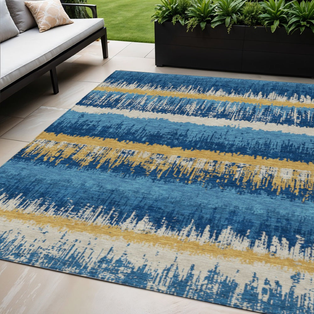 HomeRoots 5' Stylish Navy Blue Gold and Ivory Striped Washable Area Rug for Indoor and Outdoor Spaces 5' X 8' 598371