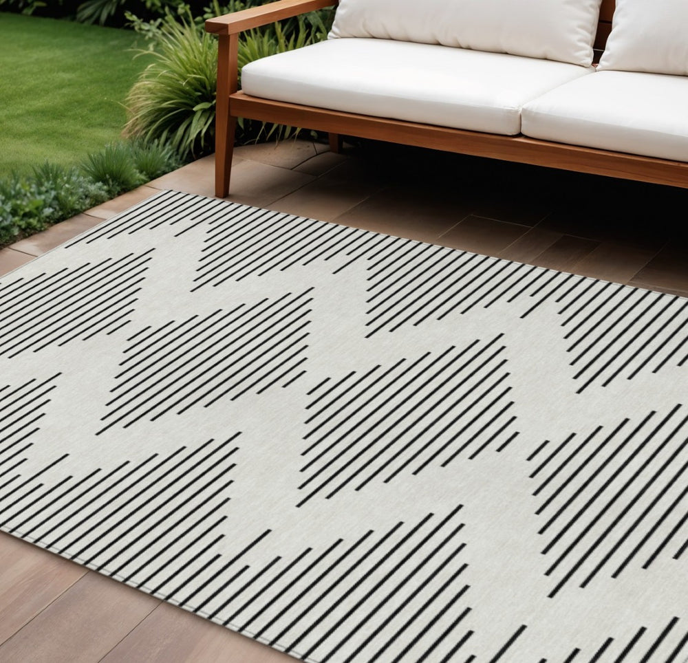 HomeRoots 9' X 12' Ivory and Black Geometric Area Rug - Washable, Durable Design for Indoor & Outdoor Spaces 598584