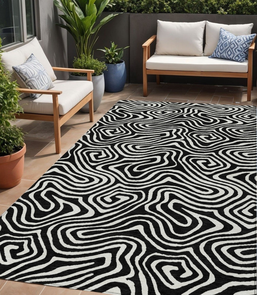 HomeRoots 5' Black and Ivory Abstract Area Rug – Washable, Durable, Indoor/Outdoor Mat for Modern Spaces 5' X 8' 598951