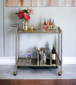 English Elm Cirro Antique Brass & Mirror Serving Cart with Tempered Glass Shelves, Wine Holder, Casters Elegance B2726P255331