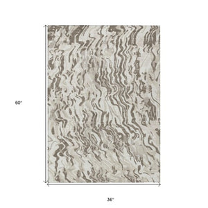 Homeroots 3' Beige Brown And Ivory Abstract Washable Area Rug For Indoor Or Outdoor Comfort And Style 3' X 5' Polyester 600300