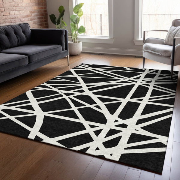 HomeRoots 5' Black and Ivory Geometric Area Rug - Stylish, Washable, Durable Design for Indoor and Outdoor Use 5' X 8' 600421