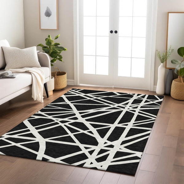 HomeRoots 5' Black and Ivory Geometric Area Rug - Stylish, Washable, Durable Design for Indoor and Outdoor Use 5' X 8' 600421