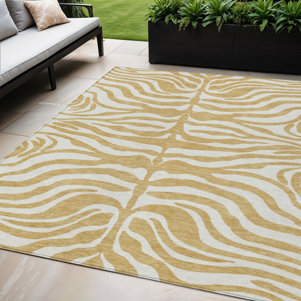 HomeRoots 5' Gold and Ivory Animal Print Area Rug - Stylish, Durable, Washable Design for Indoor and Outdoor Use 5' X 8' 600613