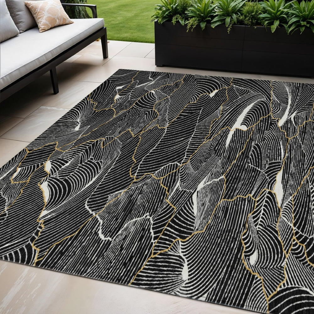 HomeRoots 5' Stunning Black Ivory Gold Abstract Washable Rug for Indoor Outdoor Spaces – Stylish & Durable 5' X 8' 601033