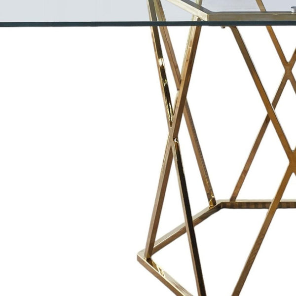 HomeRoots 63" Clear Glass and Gold Metal Geo Pedestal Dining Table - Modern Elegance for Any Space 602328