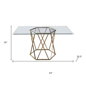 HomeRoots 63" Clear Glass and Gold Metal Geo Pedestal Dining Table - Modern Elegance for Any Space 602328