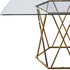 HomeRoots 63" Clear Glass and Gold Metal Geo Pedestal Dining Table - Modern Elegance for Any Space 602328