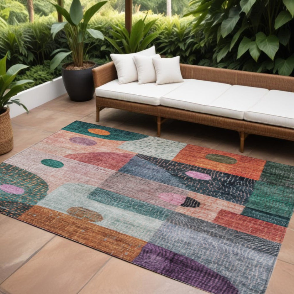 HomeRoots 9' X 12' Washable Geometric Area Rug in Bold Orange, Purple & Green for Indoor/Outdoor Spaces 604424