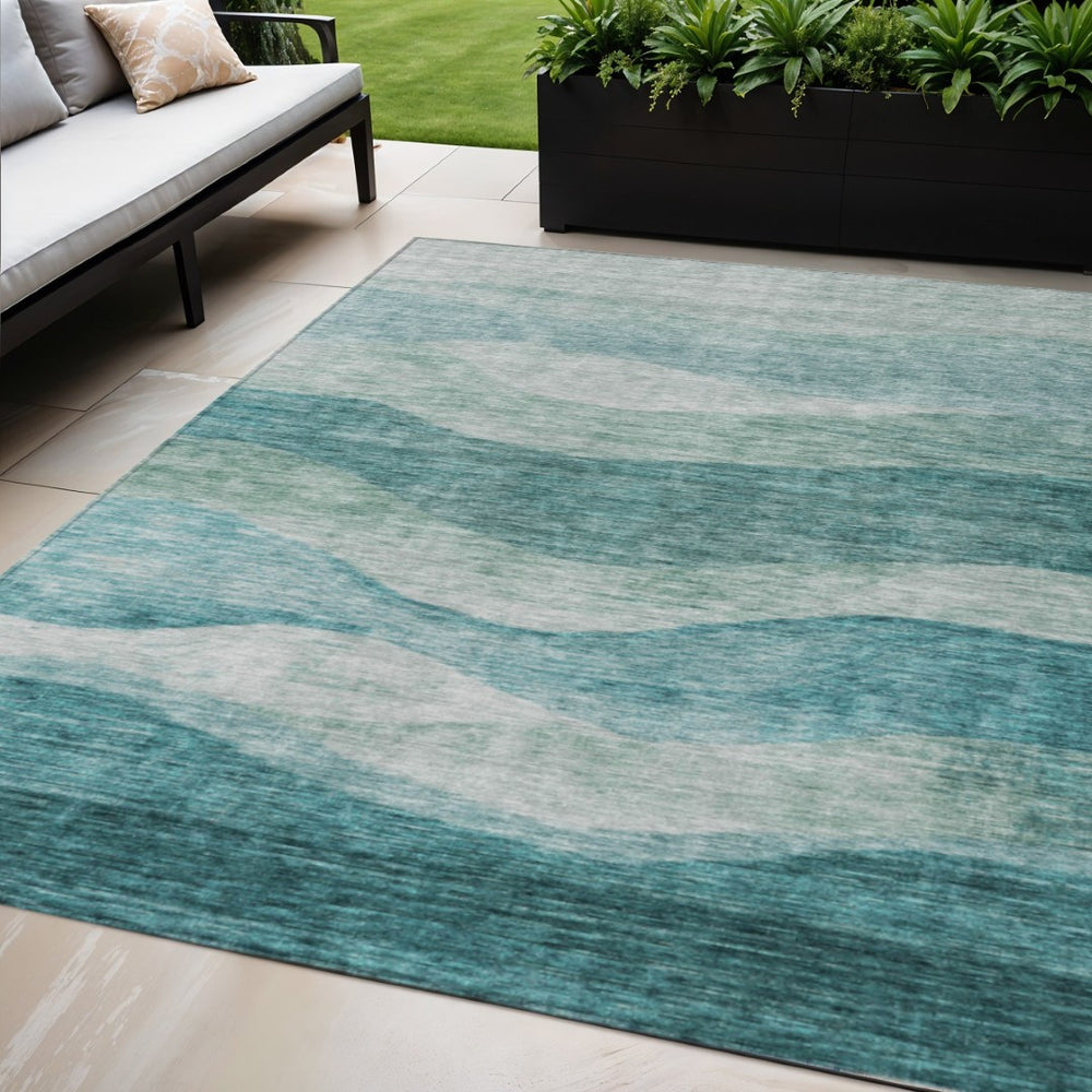 HomeRoots 5' Vibrant Teal Blue and Aqua Abstract Washable Area Rug for Indoor and Outdoor Living Spaces 5' X 8' 604990