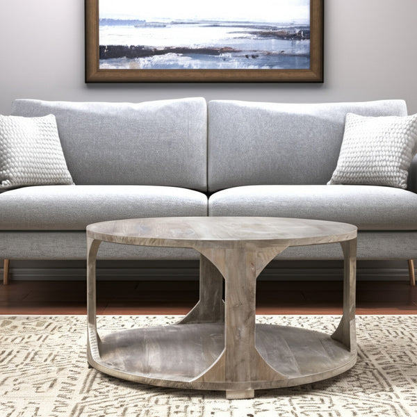 Homeroots 34" Natural Solid Wood Round Distressed Coffee Table With Shelf - Stylish & Rustic Home Accent Piece   605492