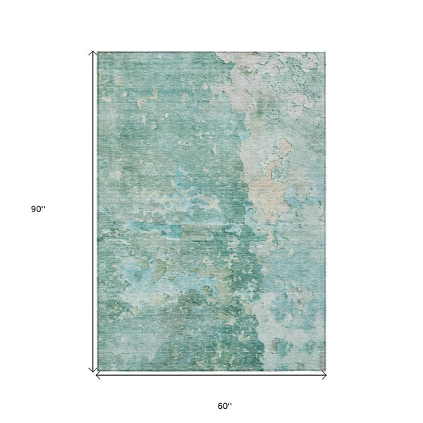 HomeRoots 5' Emerald Abstract Area Rug - Durable, Washable, Chic Design for Indoor and Outdoor Spaces 5' X 8' 607783