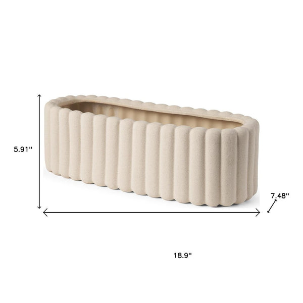 HomeRoots 6" Beige Oval Ceramic Vase with Ribbed Texture – Modern Decorative Accent for Stylish Interiors 608362