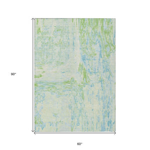 HomeRoots 5' Modern Abstract Mint Green and Blue Area Rug for Indoor Outdoor Use - Durable and Washable Design 5' X 8' 609275