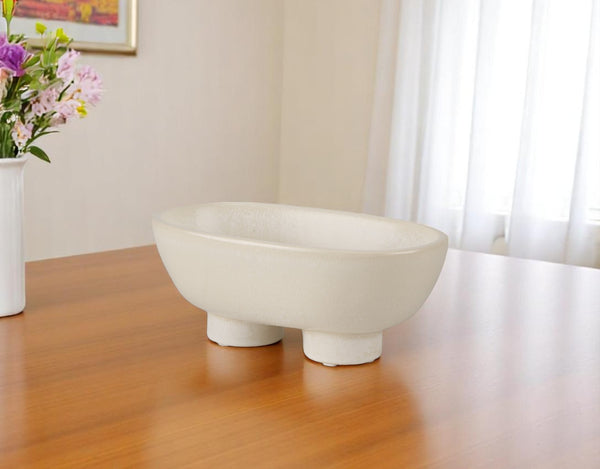 Homeroots 8" Cream Ceramic Oval Pedestal Centerpiece Bowl - Handmade Decorative Piece With Unique Glaze Finish   609343