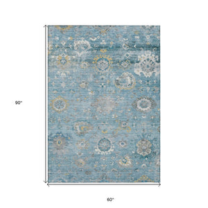 HomeRoots 5' Vibrant Teal Blue and Aqua Floral Washable Area Rug for Indoor and Outdoor Spaces - Durable Design 5' X 8' 609517
