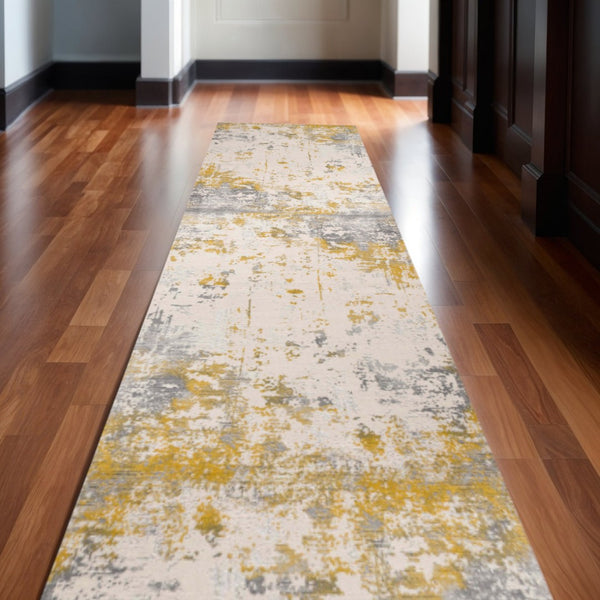 HomeRoots 2' Gold and Gray Abstract Runner Rug - Modern, Durable, Stain-Resistant for High-Traffic Areas 609824
