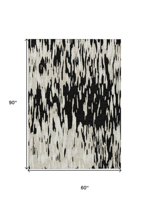 HomeRoots 5' Black and Ivory Abstract Area Rug – Durable, Washable Design for Indoor and Outdoor Use 5' X 8' 612636