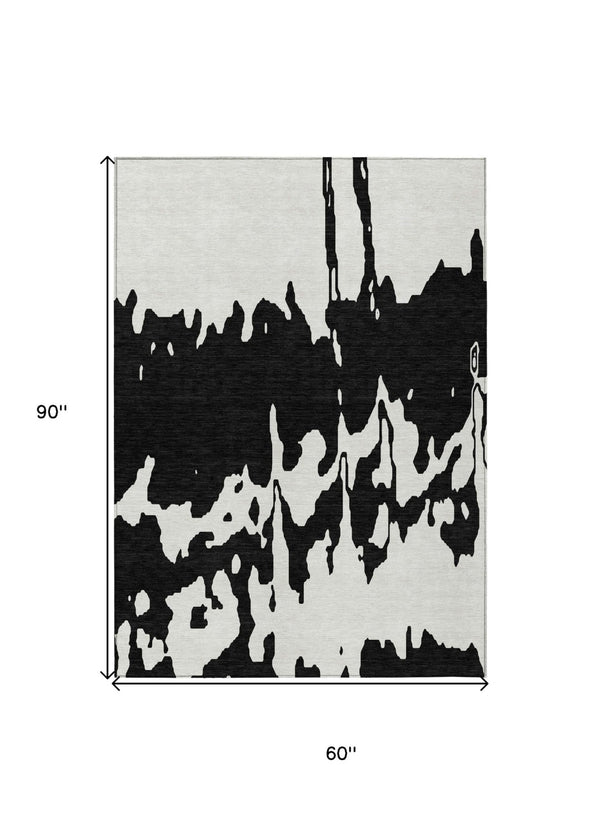 HomeRoots 5' Versatile Black and Ivory Abstract Indoor Outdoor Rug - Washable, Durable, Stylish for Any Space 5' X 8' 613615
