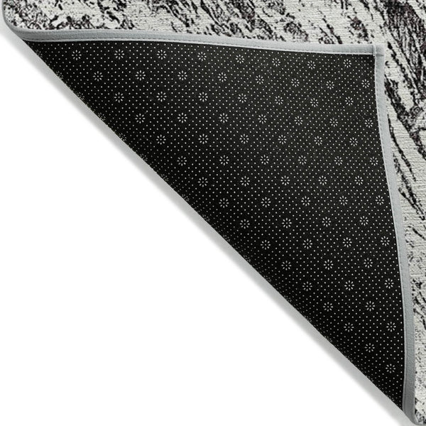 HomeRoots 5' Modern Black and Ivory Abstract Area Rug - Washable, Durable, Indoor-Outdoor Design for Any Space 5' X 8' 614276