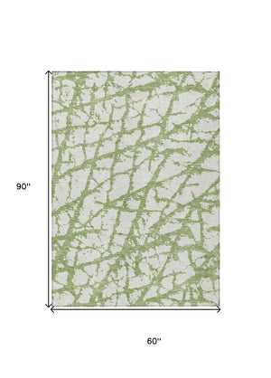HomeRoots 5' Modern Green and Ivory Abstract Washable Area Rug for Indoor and Outdoor Style and Durability 5' X 8' 614342