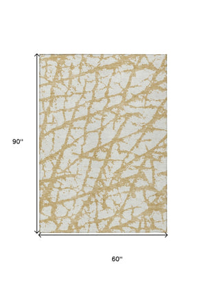 HomeRoots 5' Gold and Ivory Abstract Washable Area Rug - Durable, Stylish Design for Indoor and Outdoor Spaces 5' X 8' 614348