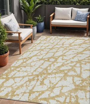 HomeRoots 5' Gold and Ivory Abstract Washable Area Rug - Durable, Stylish Design for Indoor and Outdoor Spaces 5' X 8' 614348