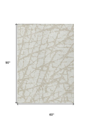 HomeRoots 5' Stylish Ivory and Beige Abstract Rug - Durable, Washable Indoor/Outdoor Area Rug for High Traffic Spaces 5' X 8' 614360