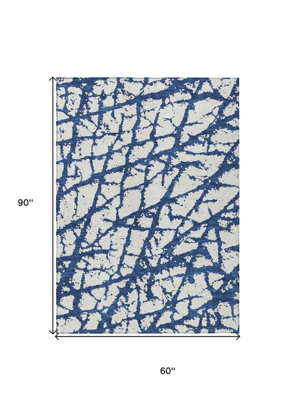 HomeRoots 5' Modern Navy Blue and Ivory Abstract Washable Area Rug for Indoor and Outdoor High-Traffic Spaces 5' X 8' 614372