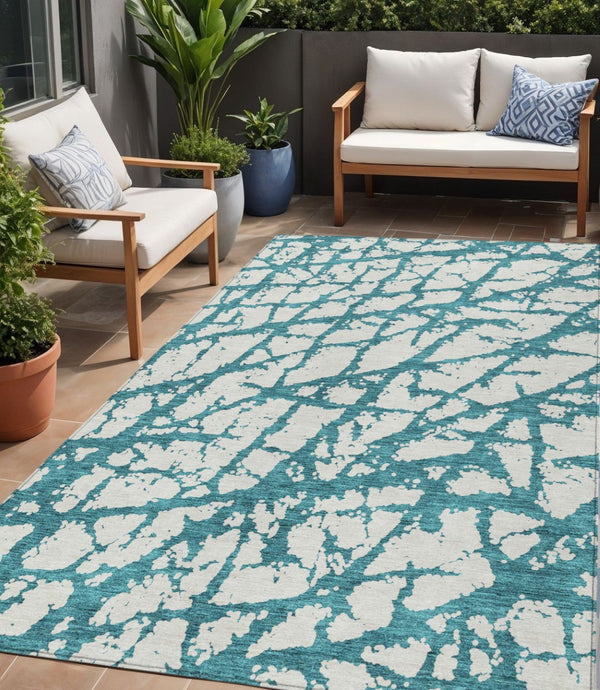 HomeRoots 5' Teal Blue and Ivory Abstract Area Rug - Durable, Washable, Perfect for Indoor and Outdoor Use 5' X 8' 614390