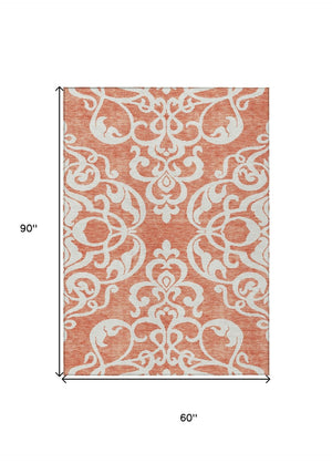 HomeRoots 5' Timeless Coral and Ivory Damask Area Rug – Washable, Durable Elegance for Indoor and Outdoor Spaces 5' X 8' 614420