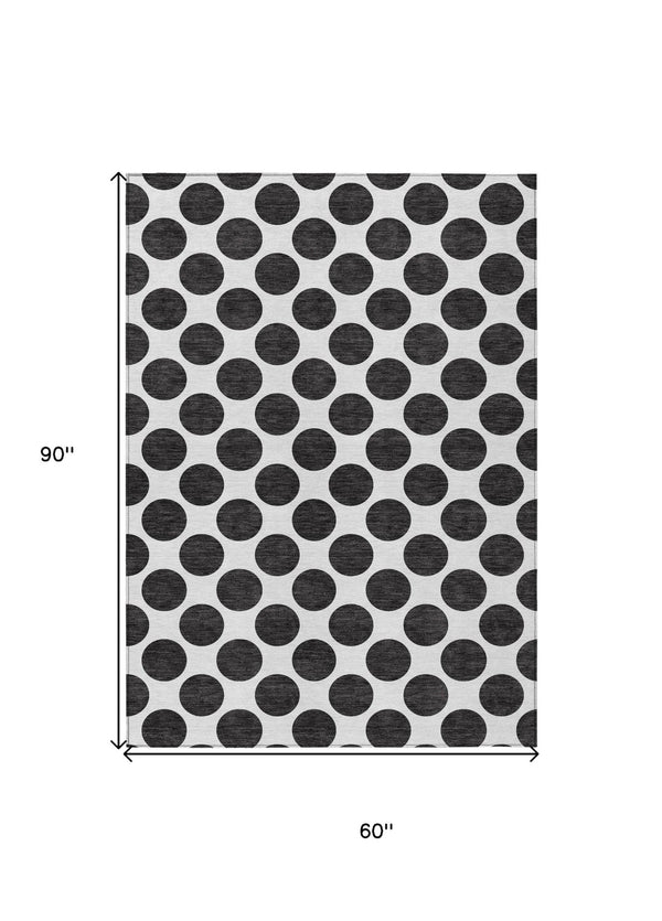 HomeRoots 5' Black and Ivory Polka Dot Washable Area Rug - Durable Design for Indoor and Outdoor Spaces 5' X 8' 614870