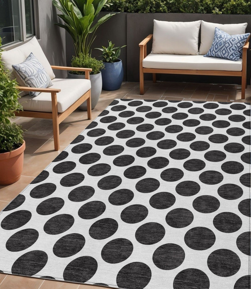 HomeRoots 5' Black and Ivory Polka Dot Washable Area Rug - Durable Design for Indoor and Outdoor Spaces 5' X 8' 614870