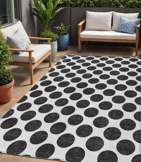 HomeRoots 5' Black and Ivory Polka Dot Washable Area Rug - Durable Design for Indoor and Outdoor Spaces 5' X 8' 614870