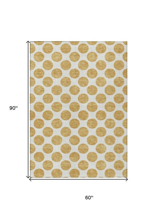 HomeRoots 5' Gold and Ivory Polka Dot Indoor Outdoor Area Rug - Durable, Washable, Non-Slip for Any Space 5' X 8' 614894