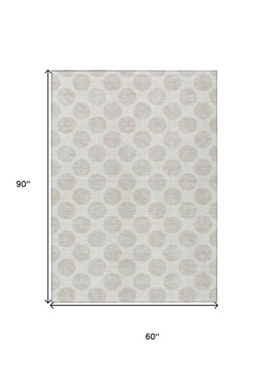 HomeRoots 5' Stylish Ivory and Beige Polka Dot Washable Area Rug for Indoor and Outdoor Spaces, Durable Design 5' X 8' 614906
