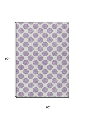HomeRoots 5' Durable Lavender and Ivory Polka Dot Area Rug – Stylish, Washable, Indoor-Outdoor Charm for Homes 5' X 8' 614912